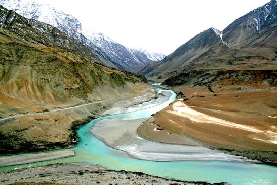 Confluence of Indus and Zanskar rivers at Sangam with turquoise waters flowing through mountain gorge