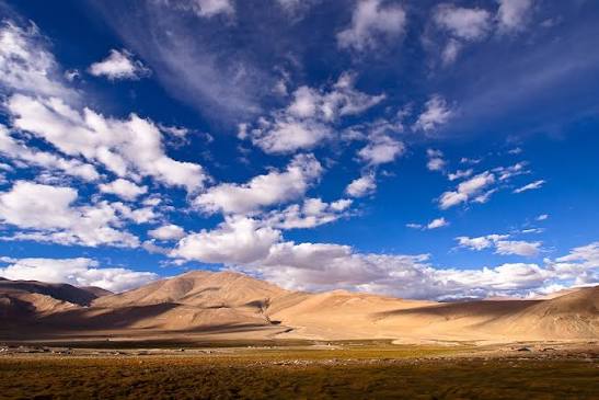 Wide panoramic view of Ladakh mountain road and barren high plateau plains in October